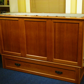 Cabinet bed- closed. Converts to queen size bed. In cherry hardwood.