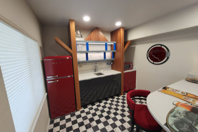 Example of a small minimalist laminate floor kitchen design in Denver with an undermount sink, flat-panel cabinets, white backsplash, quartz backsplash, an island and white countertops