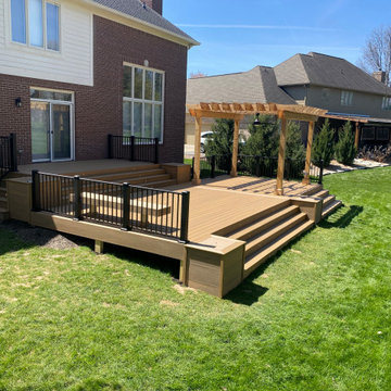 Multi level composite deck with metal railing.