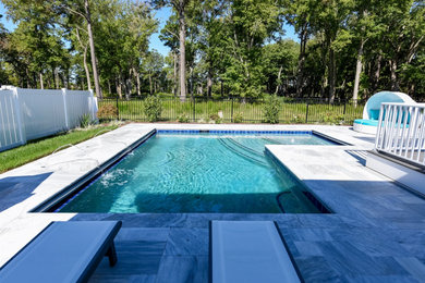 Inspiration for a mid-sized coastal backyard stone and l-shaped pool remodel in Other