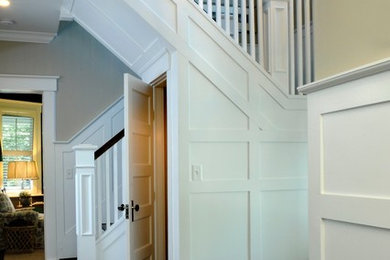 Inspiration for a farmhouse dark wood floor foyer remodel in New York