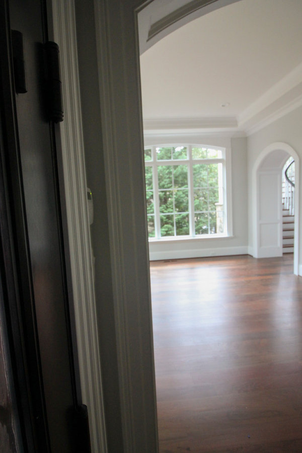 Powerful Impression by Floating Staircase in Suburban Foyer
