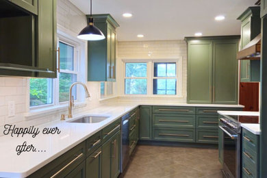 Example of a transitional l-shaped porcelain tile and gray floor eat-in kitchen design in Other with an undermount sink, shaker cabinets, green cabinets, quartz countertops, white backsplash, subway tile backsplash, stainless steel appliances and white countertops