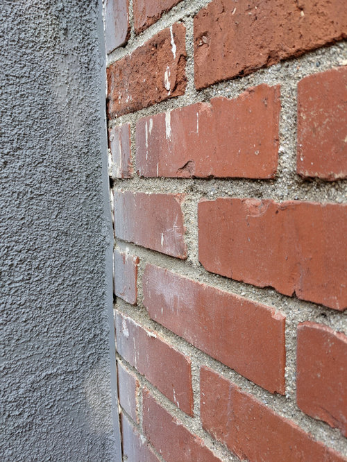 Sealing flashing between chimney and stucco