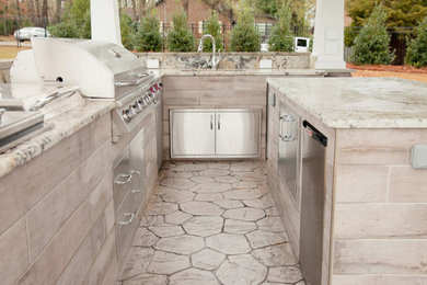 Patio - mid-sized rustic backyard stamped concrete patio idea in Other with a fire pit and a roof extension