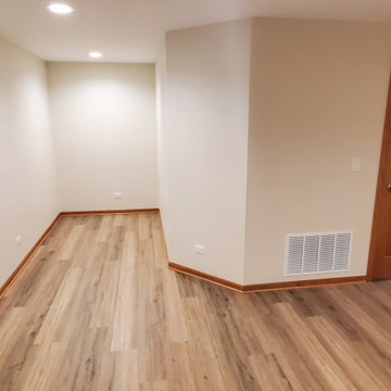 Finished basement with clipped corner around furnace/utility area