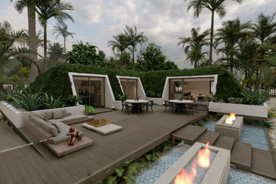 Huge minimalist exterior home photo in Other with a green roof