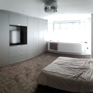 Hinged Wardrobes featuring a TV Unit and Cabinet in Borehamwood