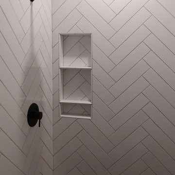White herringbone shower tile