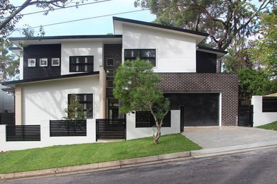 This is an example of a mid-sized contemporary two-storey exterior in Sydney.
