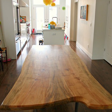 Live edge maple dining table with custom chrome base created for Toronto client