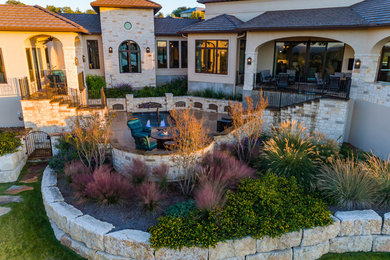 Example of a mid-sized tuscan backyard stamped concrete and rectangular pool fountain design in Other