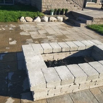 Three Tiered Unilock Patio on a waterfront.