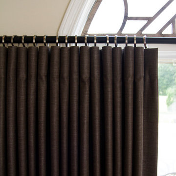 Tableaux grill for the arch window and functional panels for a Greenwood home
