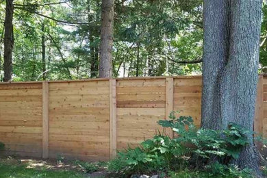 Photo of a backyard wood fence landscaping in Other.