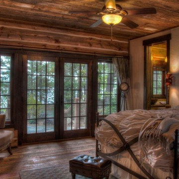 Weathered Antique Ceiling Paneling in a Traditional Log Home Bedroom