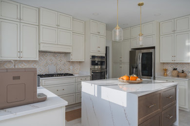 Inspiration for a mid-sized transitional u-shaped ceramic tile and beige floor eat-in kitchen remodel in Other with a single-bowl sink, shaker cabinets, yellow cabinets, quartz countertops, beige backsplash, ceramic backsplash, stainless steel appliances, an island and multicolored countertops