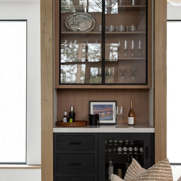 Red Oak Cabinets and Black Custom Cabinetry Create a Sleek, Modern Kitchen