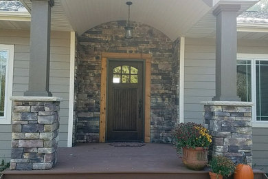 Entryway - rustic entryway idea in Minneapolis with a dark wood front door