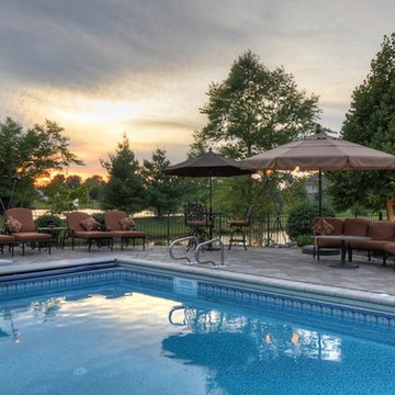 Cobblestone Landscape Renovation with Paver Pool Deck, Pergola, Outdoor Kitchen