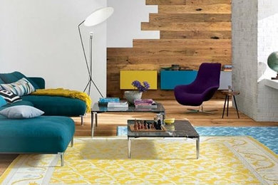 Living room - mid-sized eclectic enclosed light wood floor living room idea in Los Angeles with white walls