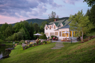 Traditional white two-story gable roof idea in Burlington