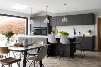 Photo of a contemporary kitchen in West Midlands with an island.