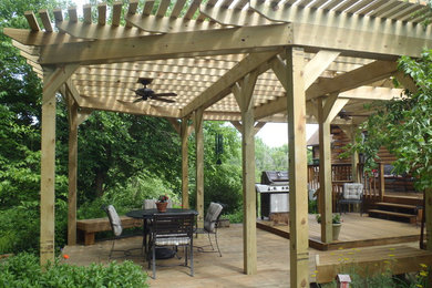 Patio - traditional backyard patio idea in Chicago with a pergola