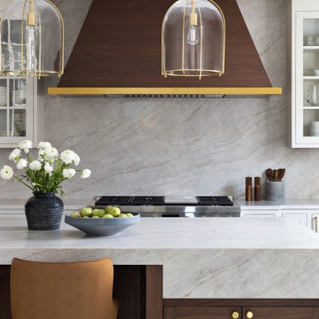 Custom Walnut and White Kitchen Remodel with Marble Slab Backsplash and Brass Ac
