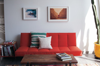 Inspiration for a mid-sized modern loft-style light wood floor living room remodel in Los Angeles with yellow walls
