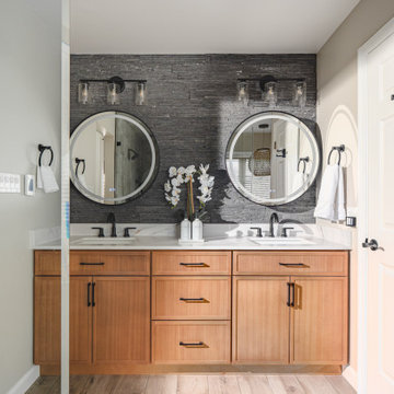Bathroom Remodel in Sterling, VA Tub, glass shower, double vanity, stone wall