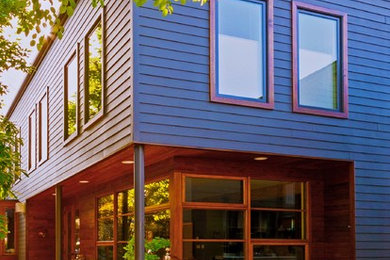 Photo of a contemporary black exterior in Seattle with mixed siding.