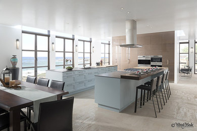 Inspiration for a large contemporary single-wall open concept kitchen remodel in Phoenix with flat-panel cabinets and two islands