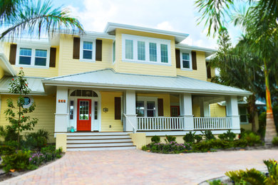 Example of a large beach style home design design in Tampa