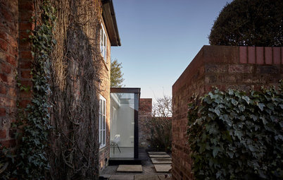 A Glass-Walled Extension Sits Proud on a Heritage Home