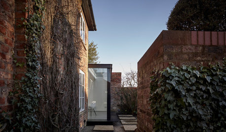 A Glass-Walled Extension Sits Proud on a Heritage Home