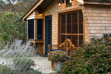 Example of a mid-sized mountain style brown one-story wood gable roof design in Boston