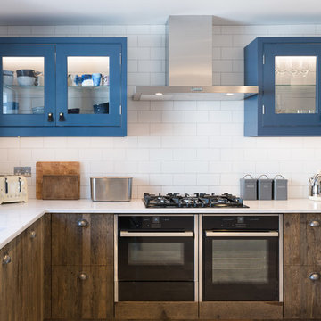 Industrial Rustic kitchen with doors made from 100 year old Reclaimed  wood.