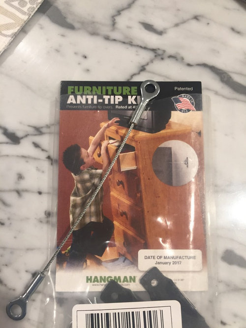 Help anchoring metal hutch to wall?