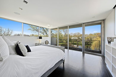 Bedroom - mid-sized contemporary guest dark wood floor and brown floor bedroom idea in Chicago with white walls and no fireplace