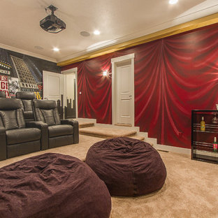 Large transitional enclosed carpeted home theater photo in Salt Lake City with multicolored walls and a projector screen