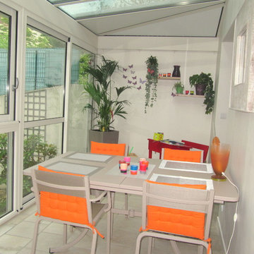 une véranda quie joue le dedans dehors