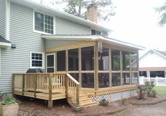 Outdoor grill on screened-in porch