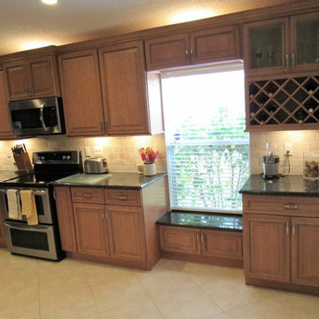Galaxy Pecan cabinets with peacock green granite
