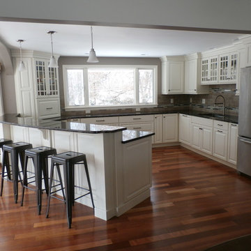 Traditional White Kitchen Remodel with Cook top in the peninsula
