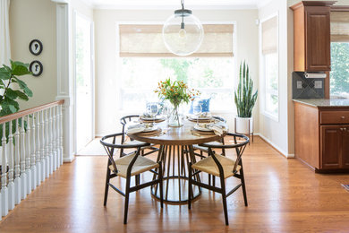 Beach style medium tone wood floor dining room photo in New York with yellow walls and no fireplace