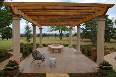 Patio - mid-sized mediterranean backyard concrete paver patio idea in Oklahoma City with a fire pit and a pergola