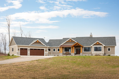 Inspiration for a large brown one-story vinyl and shingle exterior home remodel in Other with a shingle roof and a gray roof