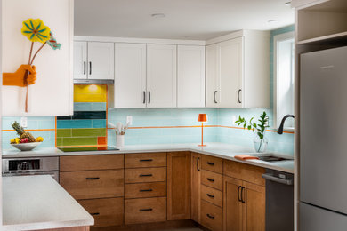 Open concept kitchen - small transitional linoleum floor and beige floor open concept kitchen idea in Seattle with an undermount sink, recessed-panel cabinets, medium tone wood cabinets, quartz countertops, multicolored backsplash, ceramic backsplash, stainless steel appliances and white countertops