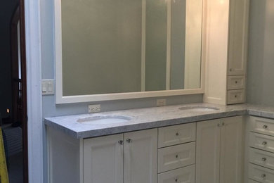 Inspiration for a mid-sized transitional master bathroom in Salt Lake City with recessed-panel cabinets, white cabinets, grey walls, ceramic floors, an undermount sink and marble benchtops.